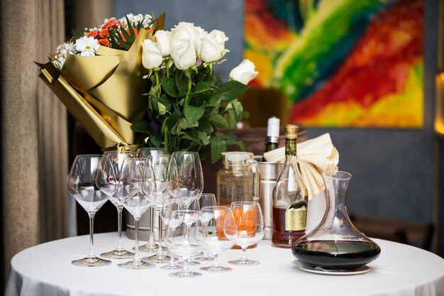 Preparing for the buffet Restaurant table with glasses and drinks