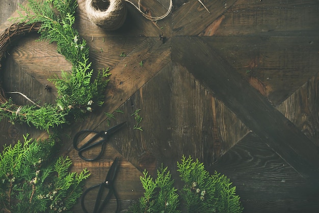 Preparing for Christmas New Year Flatlay of wreaths rope scissors