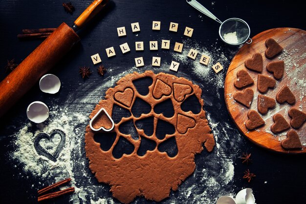 Preparing to cook homemade gingerbread for valentine's day. View from above. Gingerbread in the form of a heart.