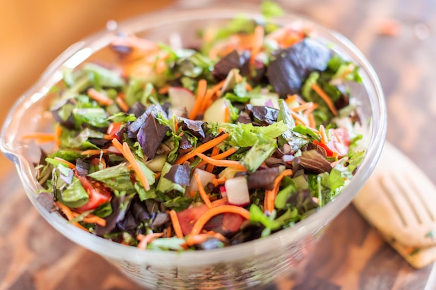 Preparing fresh salad with organic veggies.