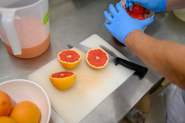 Photo preparing grapefruit in a kitchen