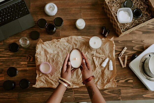 Photo preparing handcrafted candles with essential oils and scents