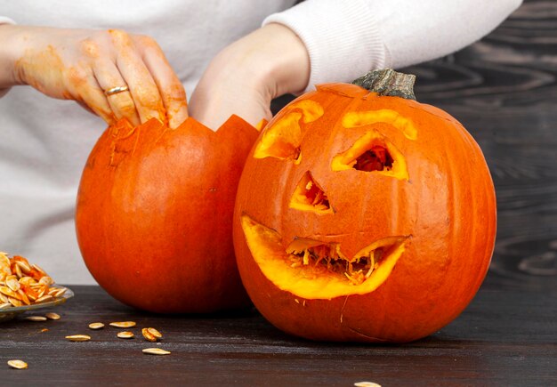 Preparing an orange pumpkin for Halloween celebration