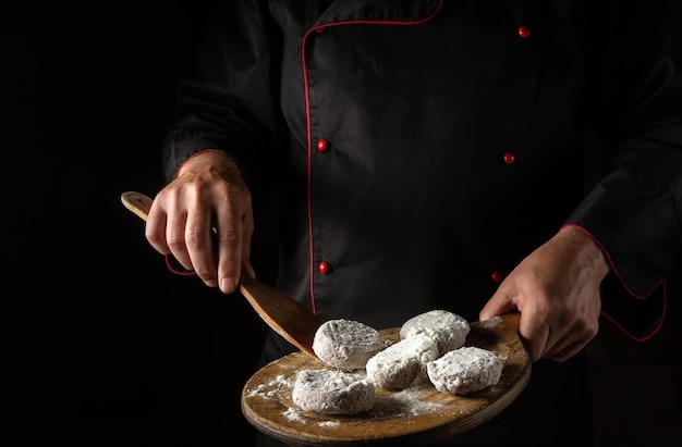 Preparing pork and veal cutlets for a burger by the hands of a chef