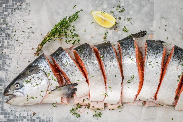 Preparing salmon with thyme and salt for grill