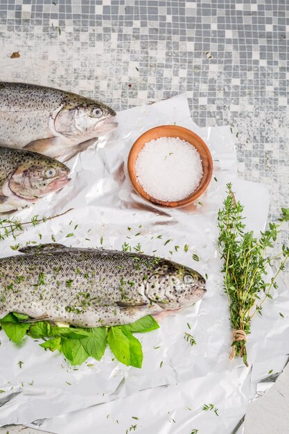 Preparing whole trout with thyme and salt