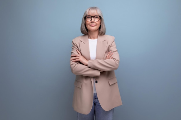 Preppy fresh s middle aged business woman in stylish look on bright studio background with copy