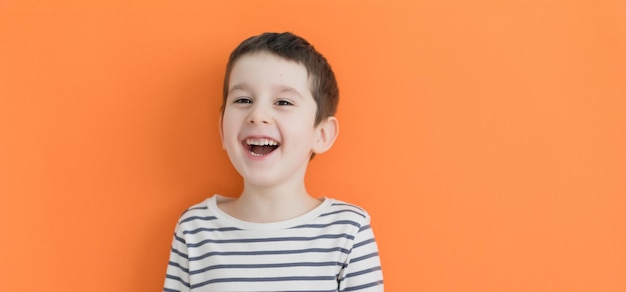 Preschool boy on an orange background