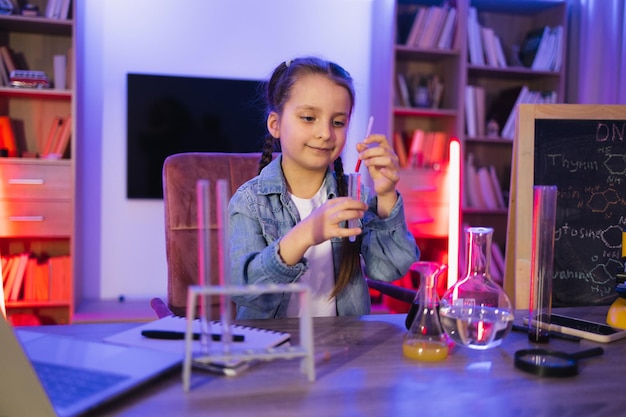 Preschool child performing experiment of learning and education