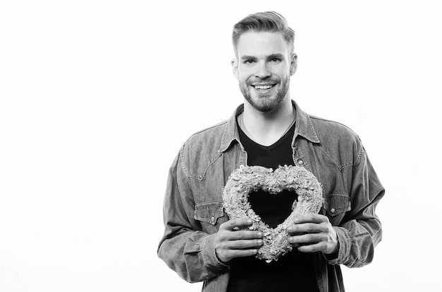 Present for you unshaved man isolated on white Happy man with decorative heart Date Romantic greeting Valentines day sales Love and romance Valentines day party copy space