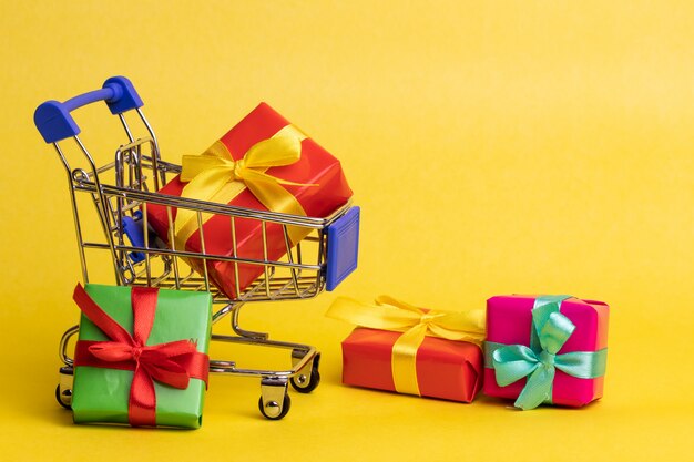 Presents in shopping cart. Closeup