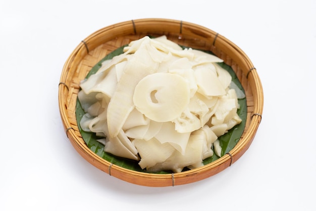 Preserved bamboo shoot slices on white background.