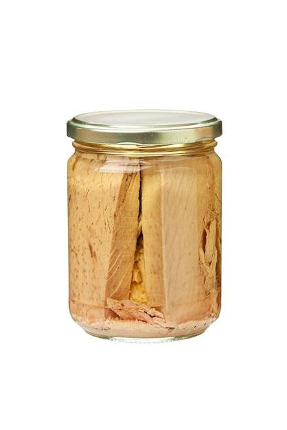 Preserved tuna fish fillets in a glass jar Isolated on white