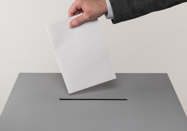 Presidential and parliamentary elections The voter throws the ballot into the ballot box