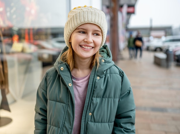 Preteen girl street portrait in city