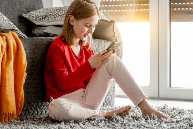 Preteen girl with smartphone