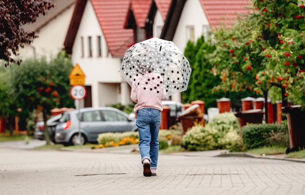 Preteen girl with umbrella