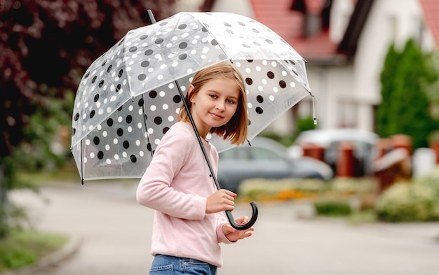 Preteen girl with umbrella