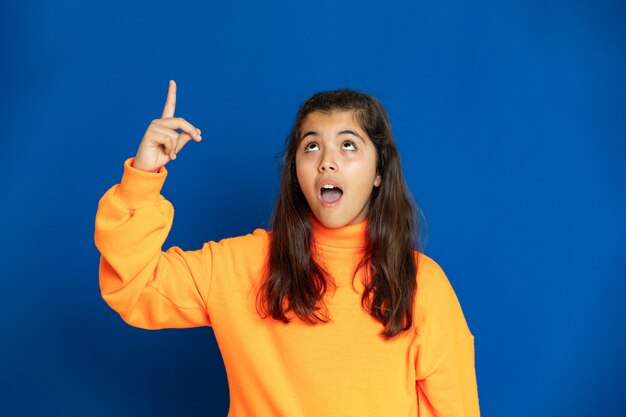 Preteen girl with yellow sweatshirt