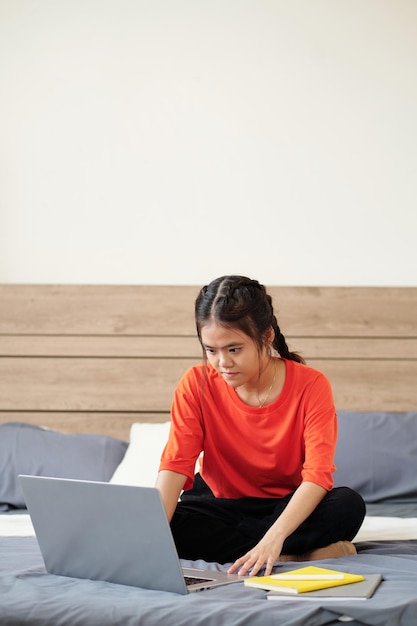 Preteen Girl Working on Laptop