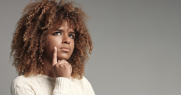 Pretty black girl with big hair posing video thinking about has problem