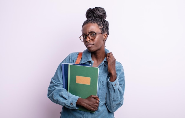 Pretty black woman looking arrogant successful positive and proud student with books concept