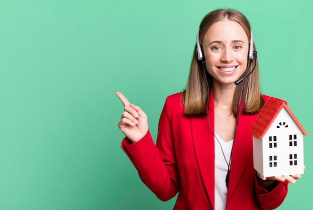 Pretty blonde businesswoman real state telemarketer concept