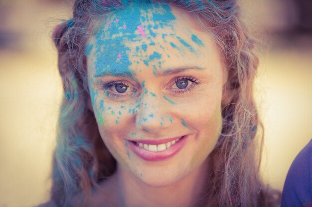 Pretty blonde covered with powder paint