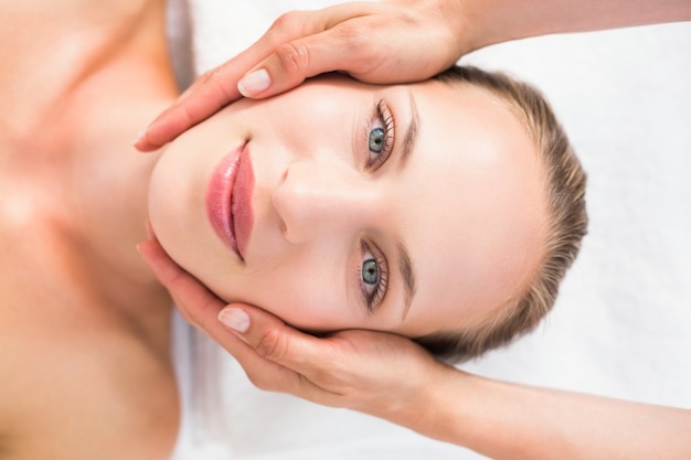 pretty blonde receiving head massage