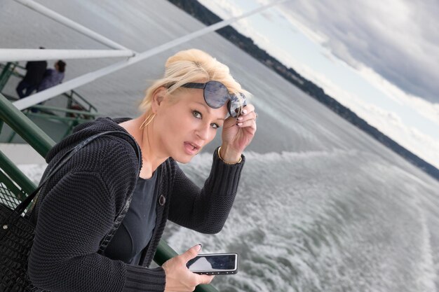 Pretty blonde tourist on a ferry