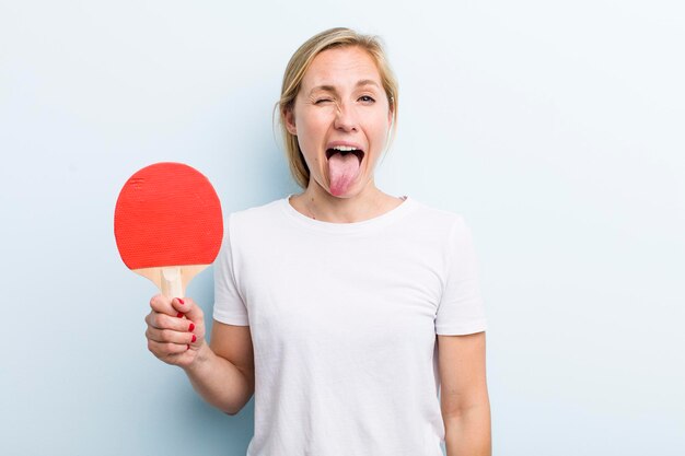 Pretty blonde young adult woman ping pong concept