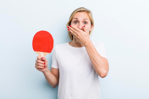 Pretty blonde young adult woman ping pong concept