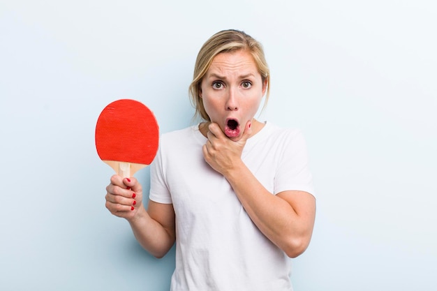 Pretty blonde young adult woman ping pong concept