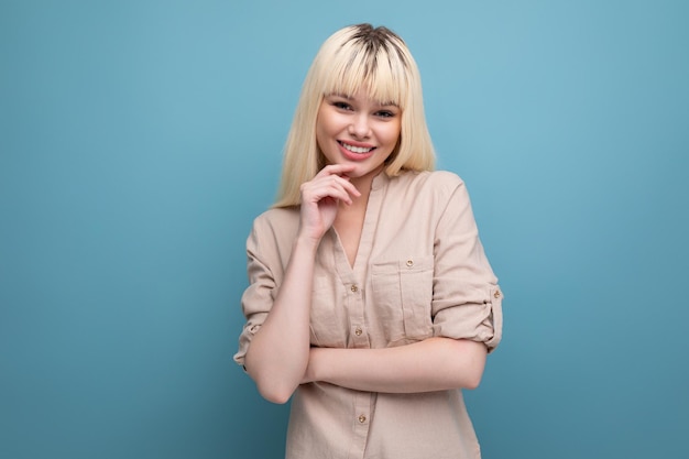 Pretty blondie young caucasian woman in casual clothes with regrown hair roots