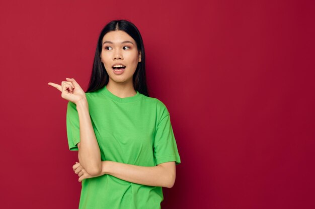 Pretty brunette emotions posing gesture hands grimace isolated background unaltered