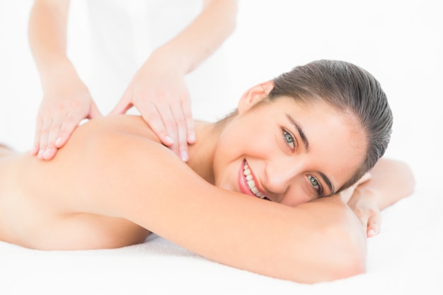 Pretty brunette enjoying a massage