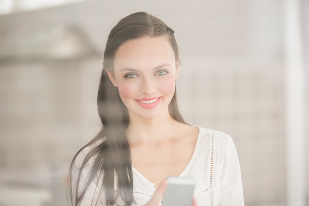 Pretty brunette sending a text