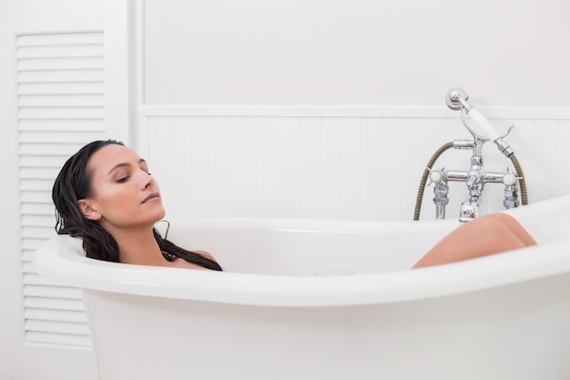 Pretty brunette taking a bath 