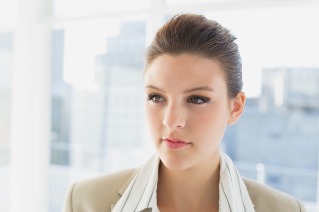 Pretty businesswoman looking and thinking