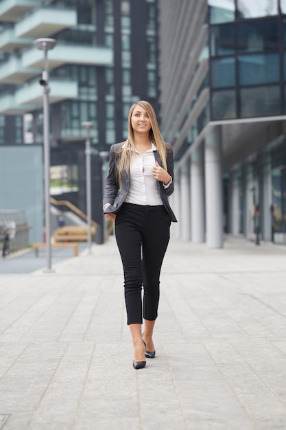 Pretty businesswoman in urban environment