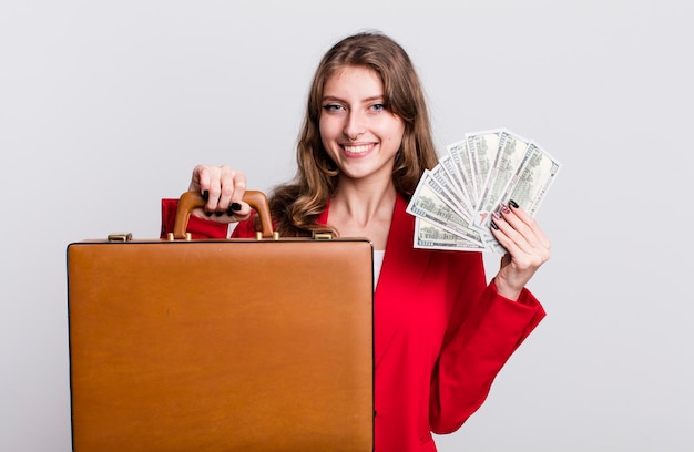 Pretty businesswoman with bills and a suitcase