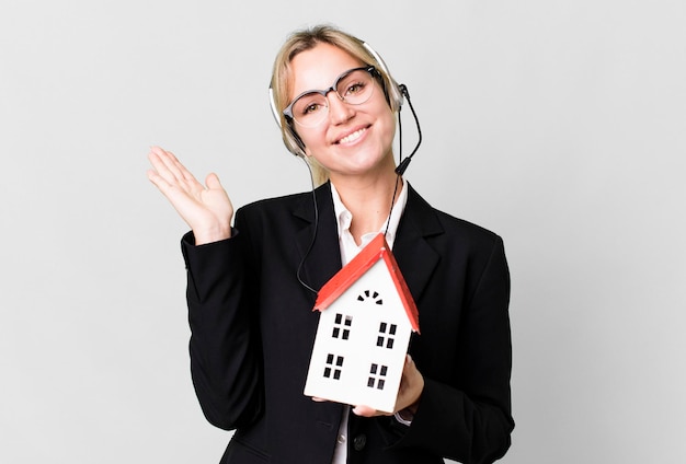 Pretty caucasian blonde businesswoman real state agent with headset