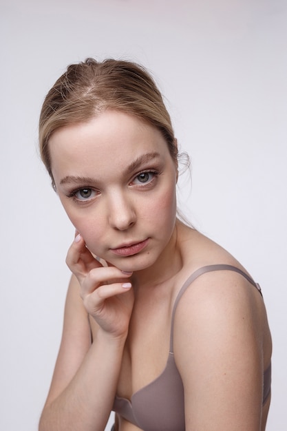 Pretty caucasian girl with naked shoulders. portrait, close up