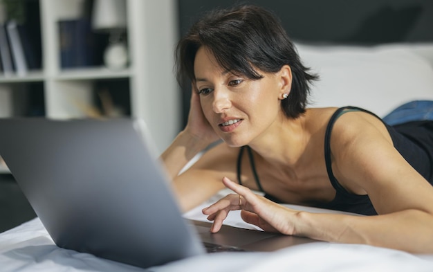 Pretty caucasian lady typing on wireless