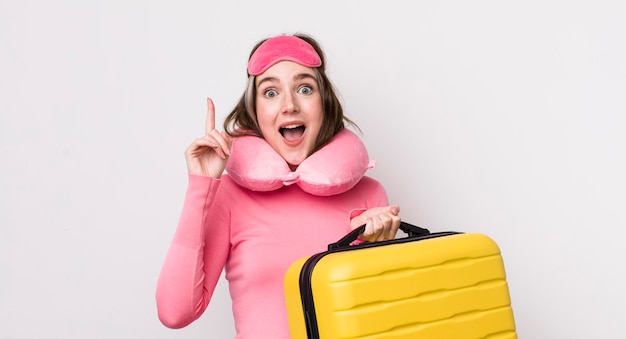 Pretty caucasian woman feeling like a happy and excited genius after realizing an idea flight passenger concept