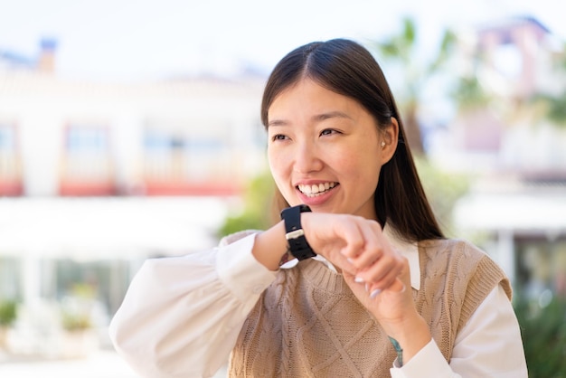 Pretty Chinese woman with sport watch