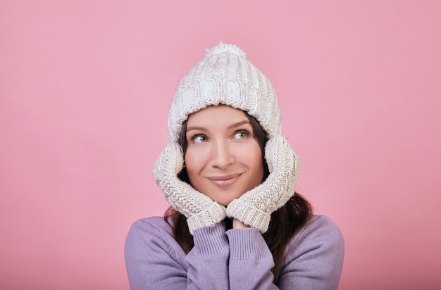 A pretty dark-haired woman with green eyes in knitted hat