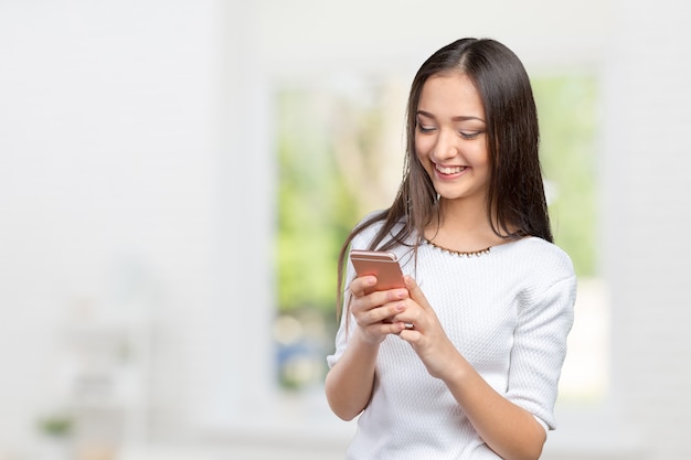 pretty female teenager using smartphone