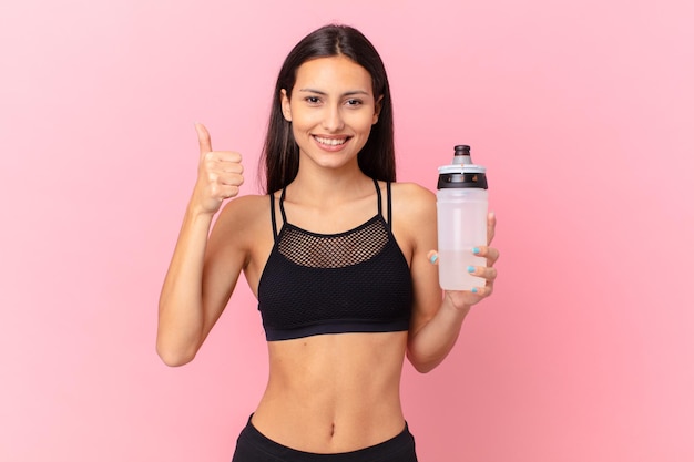 Pretty fitness woman with a water bottle