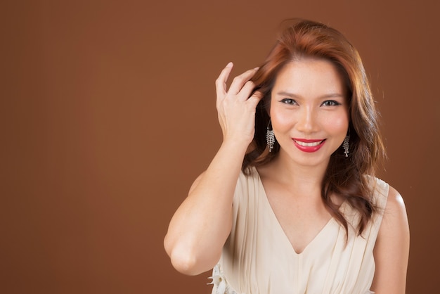 Pretty girl on brown background